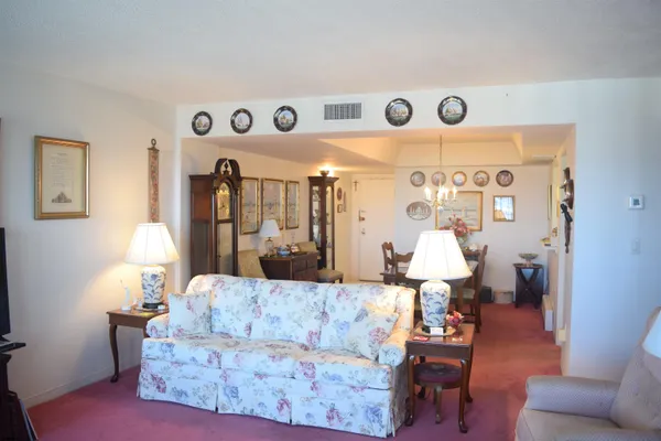 a very nice looking dining room with a table and chairs