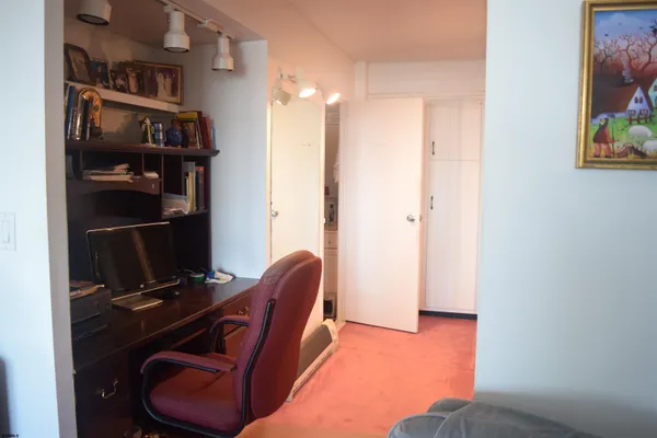 a view of living room with furniture and wooden floor