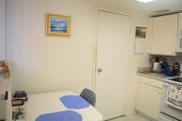 a view of kitchen and dining room with furniture