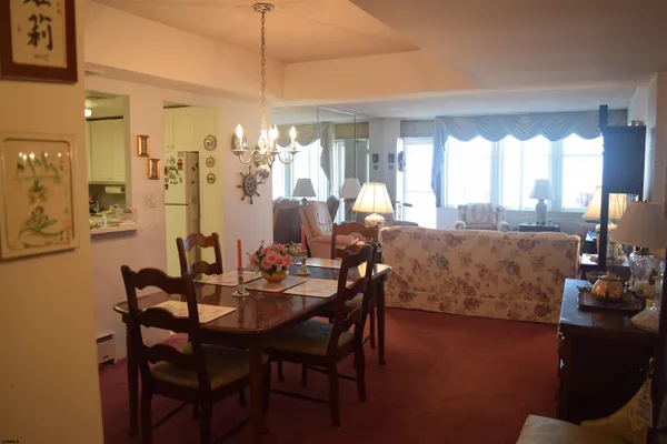 a view of a dining room with furniture and a window