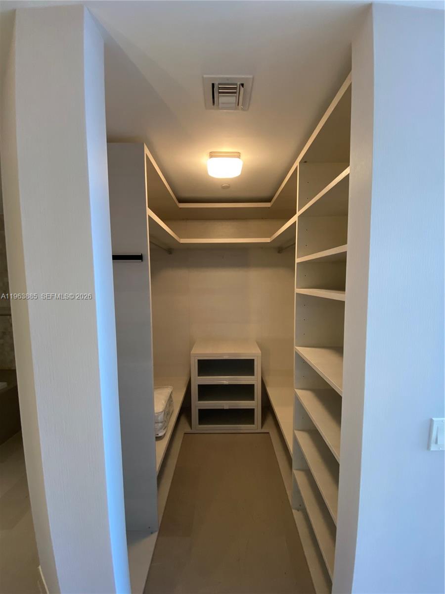 88 Southwest 7th Street, Unit 1904 Miami, FL 33130 - Photo 25 of 33 a view of an empty walk in closet