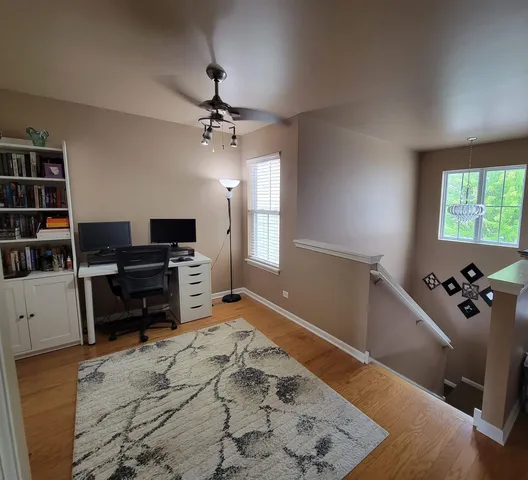 a bedroom with furniture and a flat screen tv