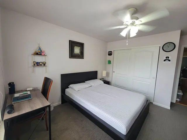 a bedroom with a bed and a table in it