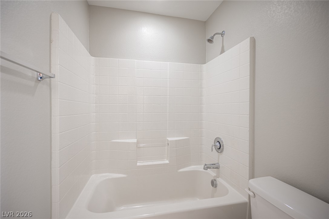 9916 Sable Point Street Las Vegas, NV 89178 - Photo 20 of 73 Bathtub and shower combo for unwinding after a long day.