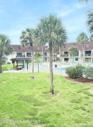 a view of a garden and trees