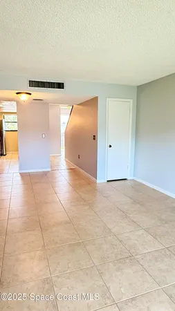 a view of a kitchen with an empty space