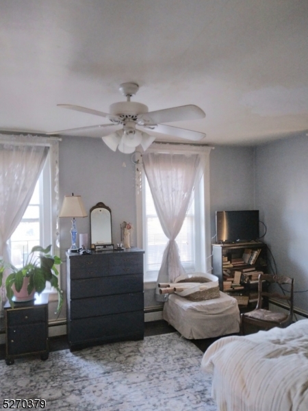 191 Mt Joy Road Phillipsburg, NJ 08865 - Photo 11 of 29 a living room with furniture a fireplace and a flat screen tv