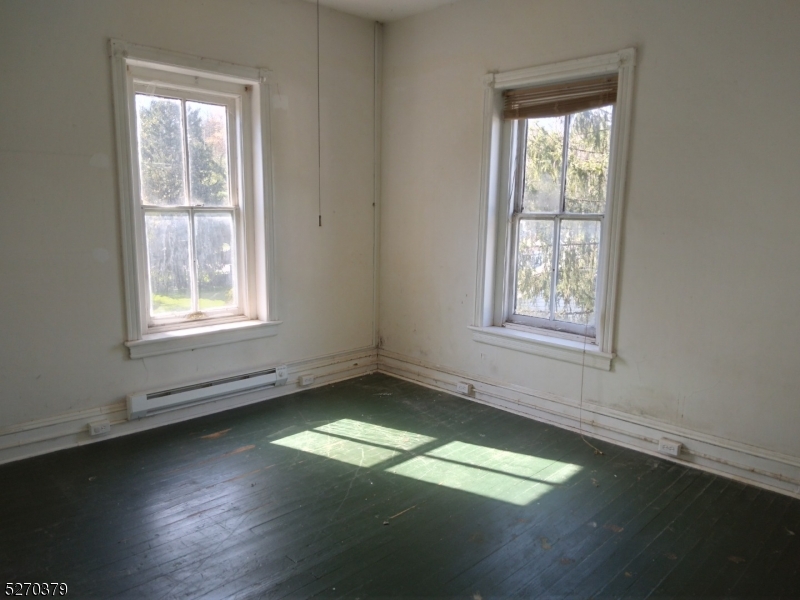 191 Mt Joy Road Phillipsburg, NJ 08865 - Photo 23 of 29 an empty room with wooden floor and windows