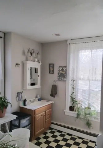 a view of bathroom with dual sinks