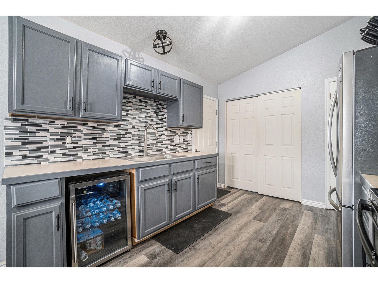 2601 Alpine Avenue Greeley, CO 80631 - Photo 11 of 20 a kitchen with stainless steel appliances granite countertop a sink stove and refrigerator