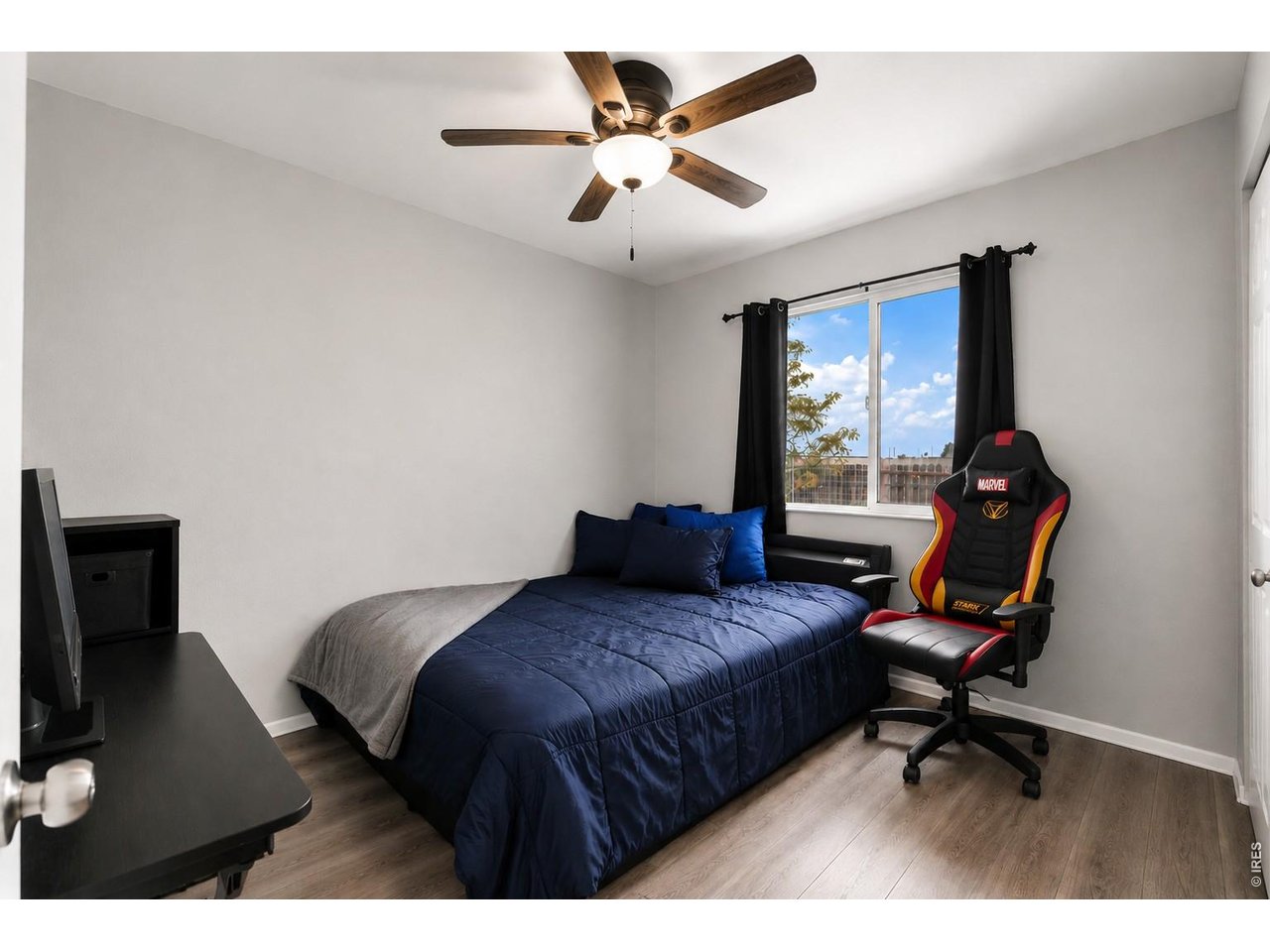 2601 Alpine Avenue Greeley, CO 80631 - Photo 14 of 20 a bedroom with a bed a desk and chair