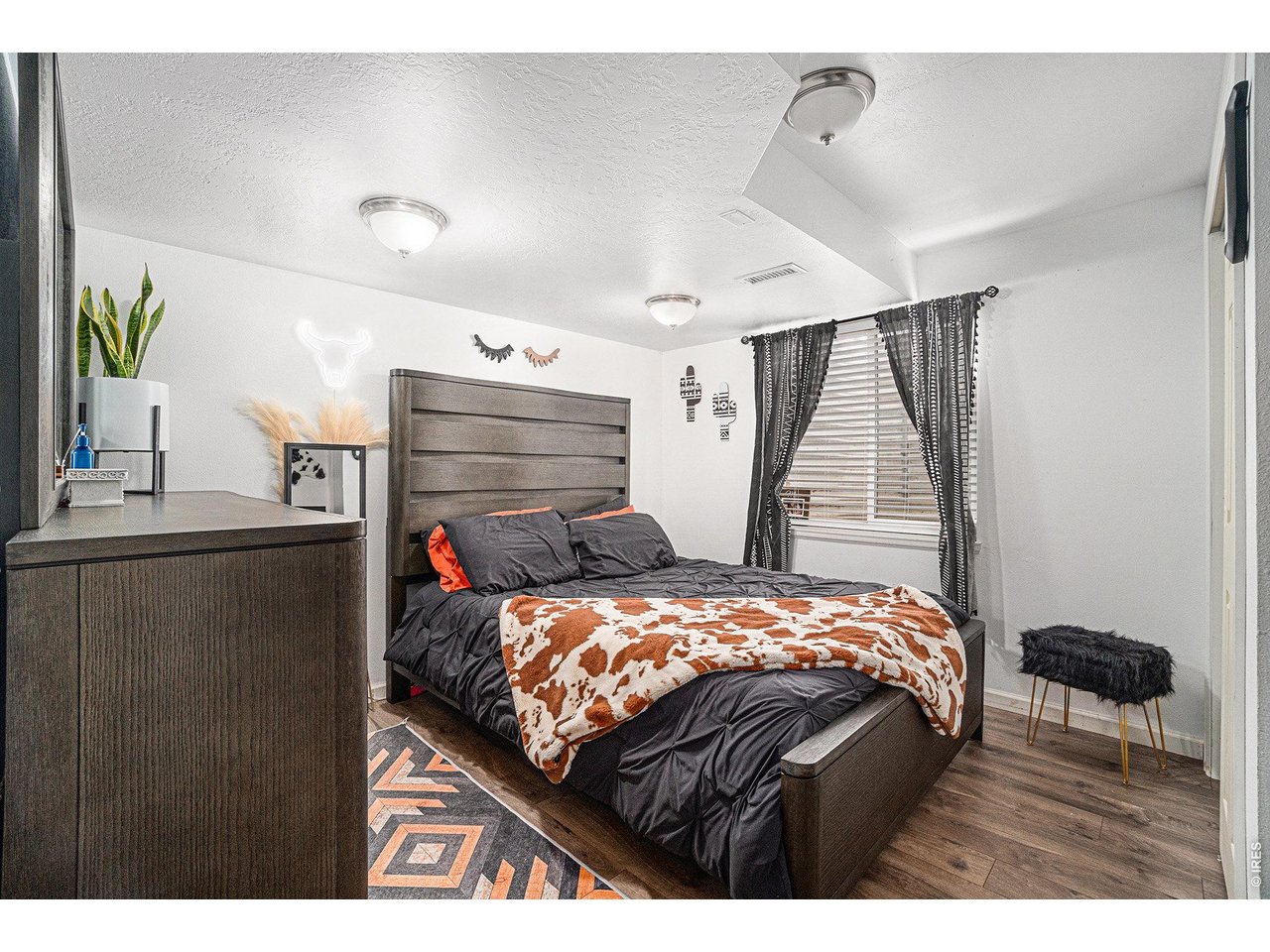 2601 Alpine Avenue Greeley, CO 80631 - Photo 17 of 20 a bedroom with a bed and a window