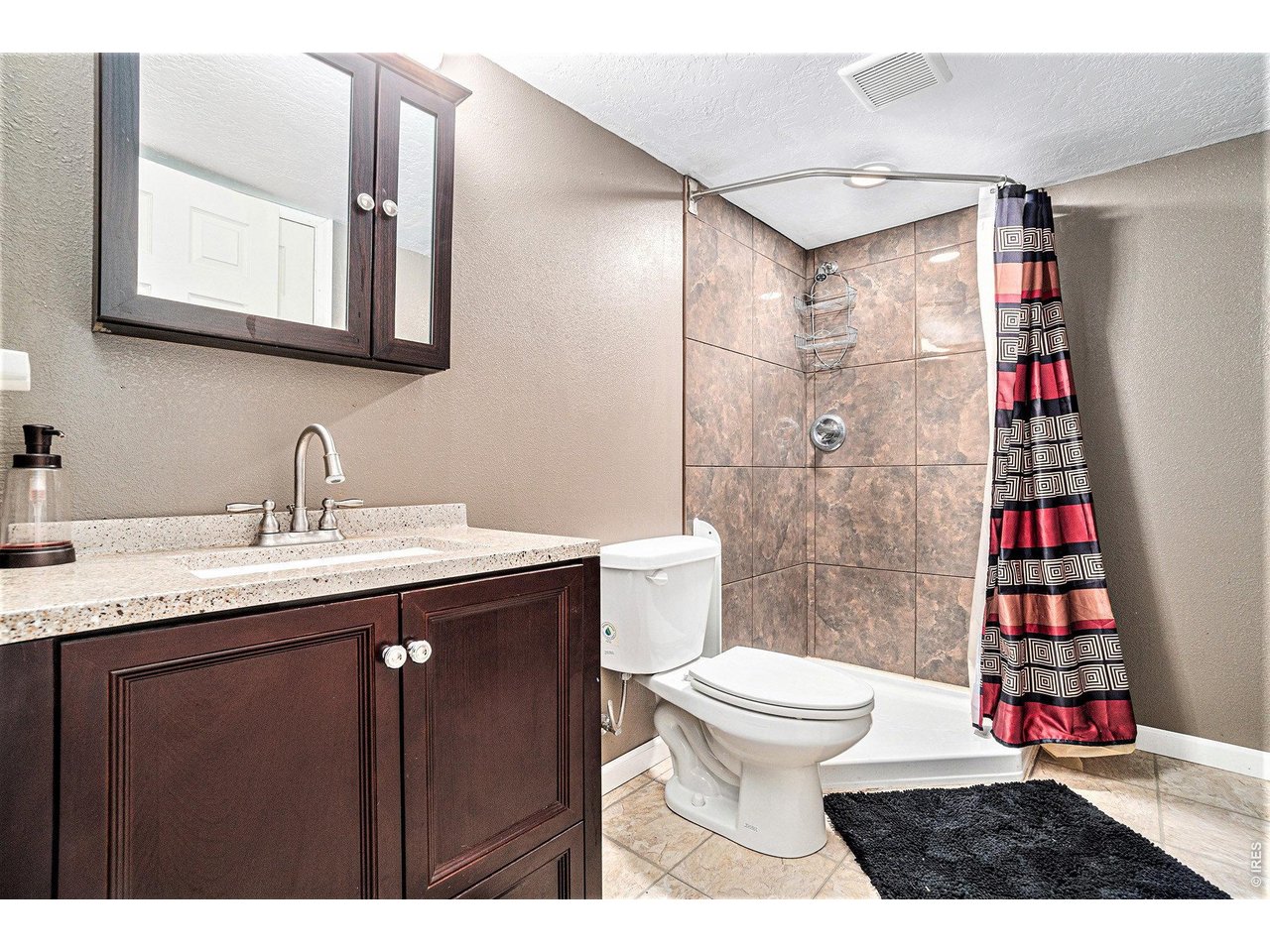 2601 Alpine Avenue Greeley, CO 80631 - Photo 18 of 20 a bathroom with a sink toilet and shower