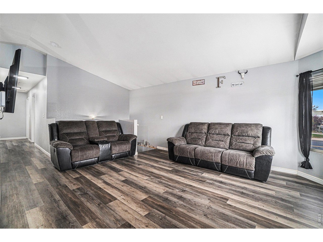 2601 Alpine Avenue Greeley, CO 80631 - Photo 4 of 20 a living room with furniture and a wooden floor