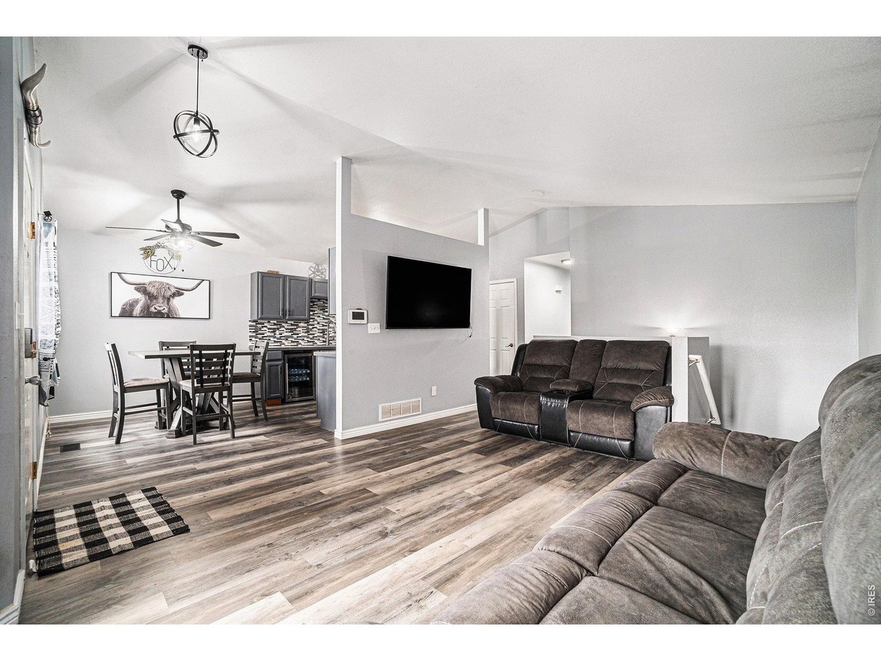 2601 Alpine Avenue Greeley, CO 80631 - Photo 6 of 20 a living room with furniture and a flat screen tv