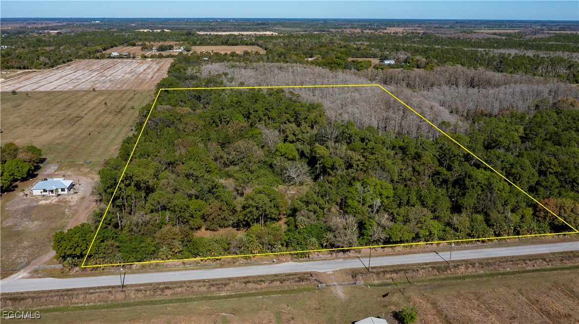 850 G Road LaBelle, FL 33935 - Photo 3 of 24 an aerial view of residential houses with outdoor space and trees