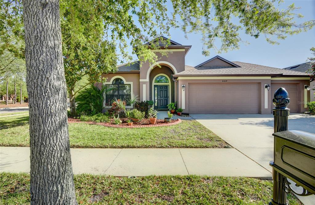 8404 White Poplar Drive Riverview, FL 33578 - Photo 1 of 1 a front view of a house with garden