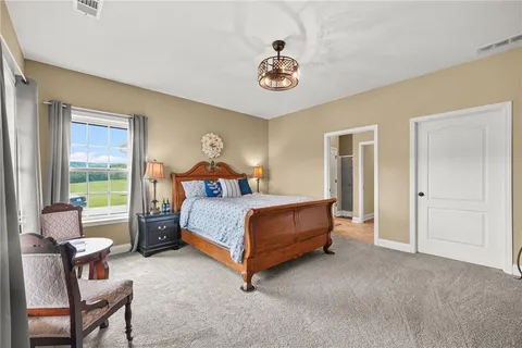 a bedroom with a bed and a table