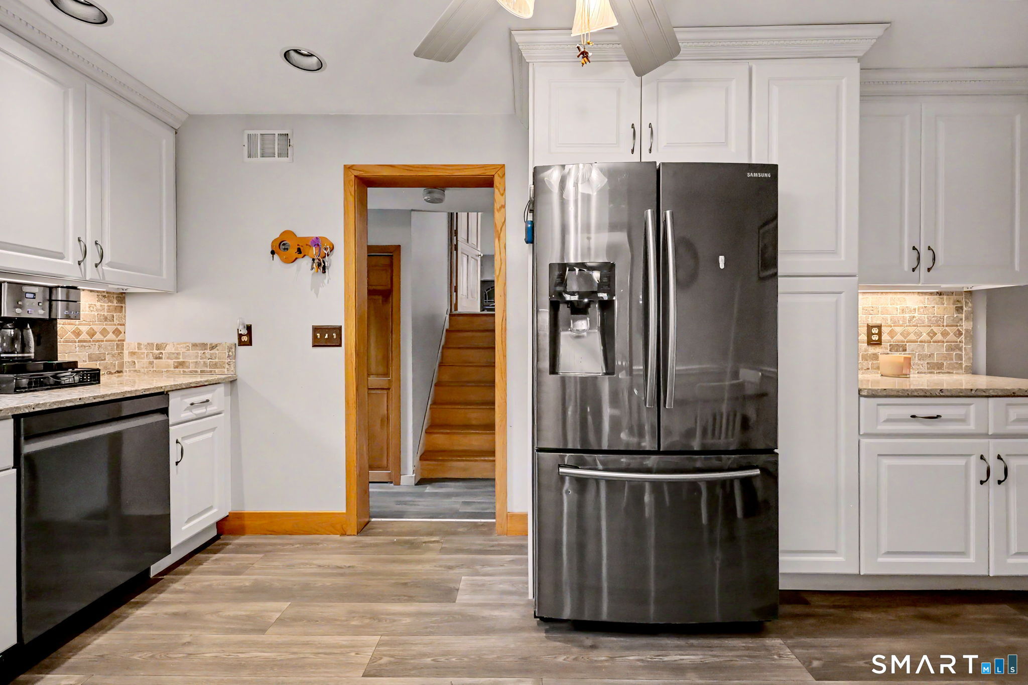 7 Merrill Road Trumbull, CT 06611 - Photo 10 of 40 a kitchen with stainless steel appliances granite countertop a refrigerator and a stove