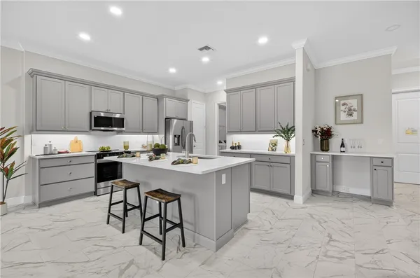 a hallway with view of kitchen and living room