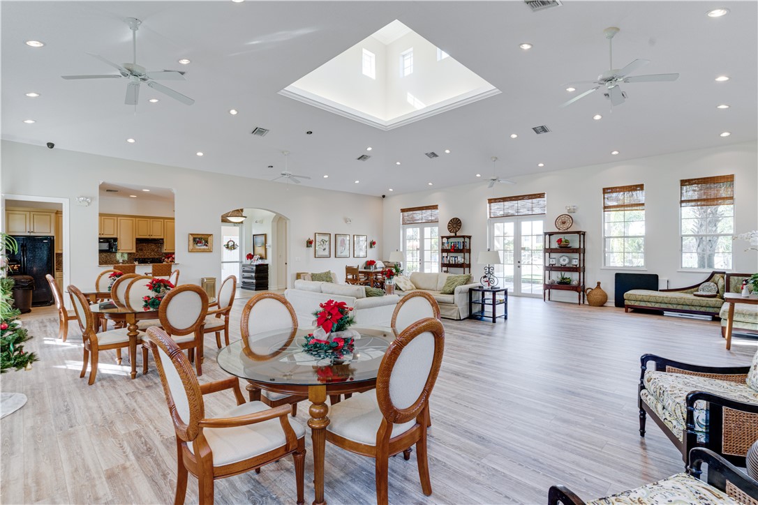 1805 Bridgepointe Circle, Unit 2 Vero Beach, FL 32967 - Photo 27 of 28 a view of a dining room with furniture and wooden floor