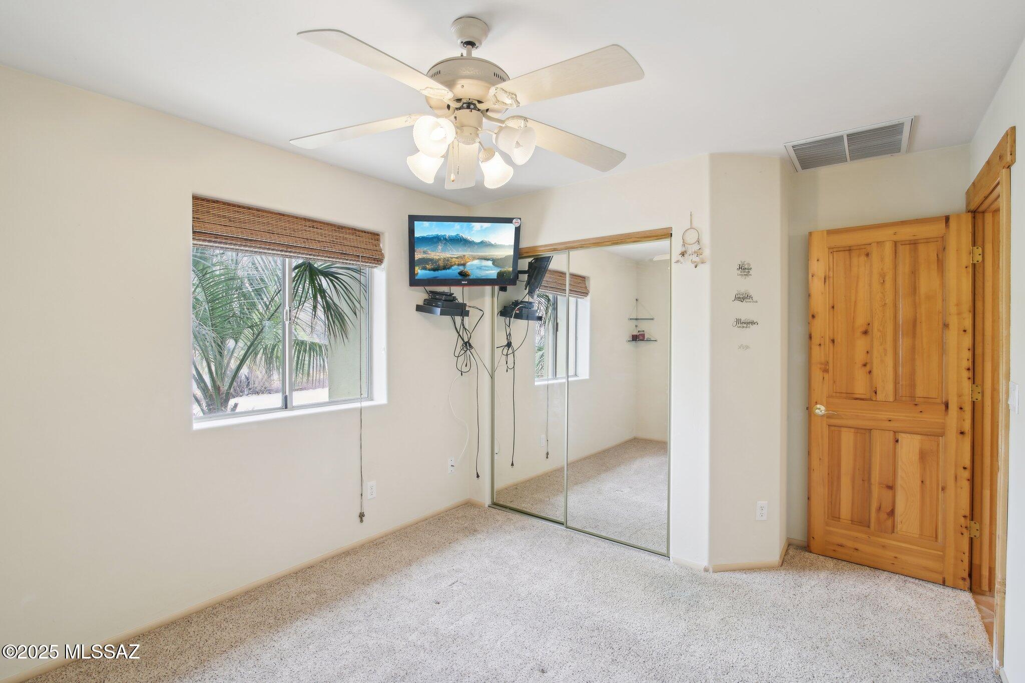 351 Camino Canoa Rio Rico, AZ 85648 - Photo 15 of 34 wooden floor in an empty room with a window