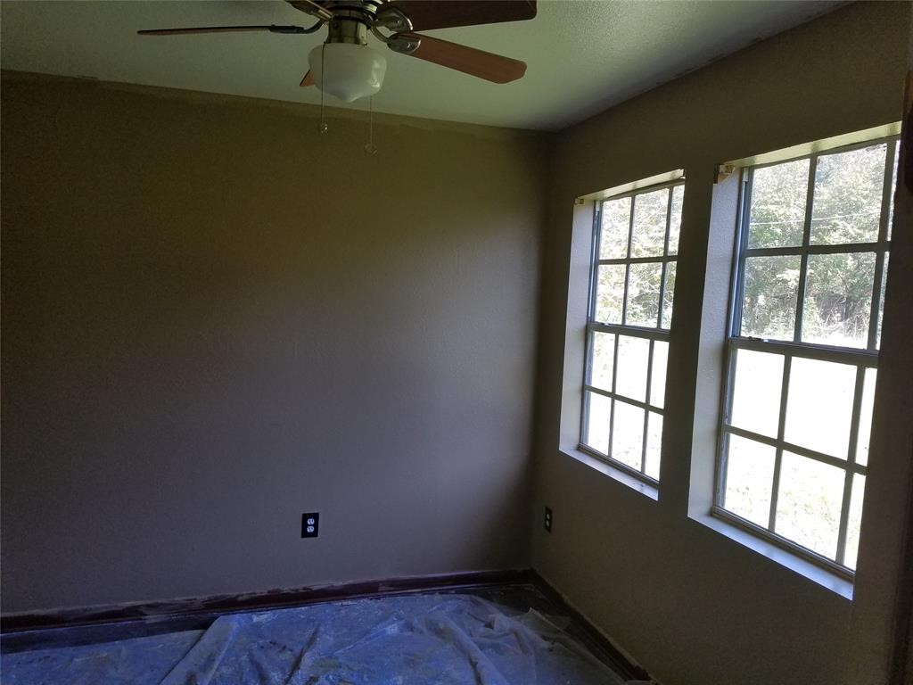 2326 Houston Street Orange, TX 77630 - Photo 6 of 7 an empty room with a window