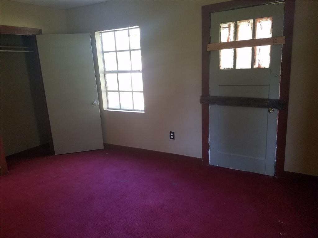 2326 Houston Street Orange, TX 77630 - Photo 7 of 7 an empty room with a window