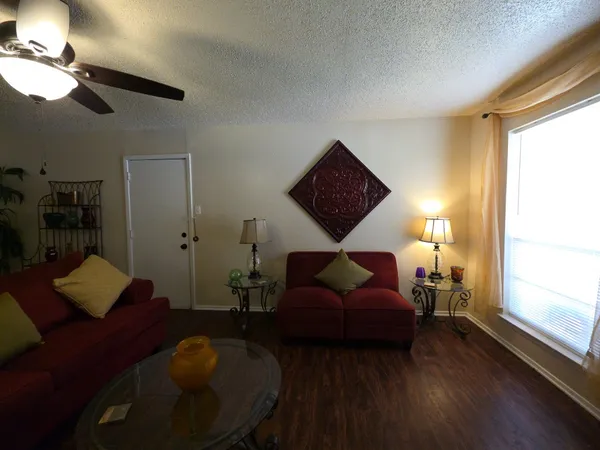 a living room with furniture and a window