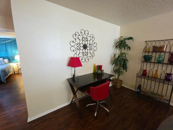 a room with furniture and a potted plant