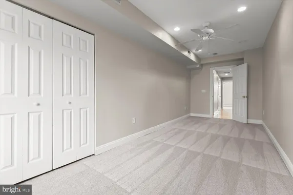 a view of an empty room with a chandelier