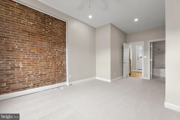 a view of an empty room with a bathroom
