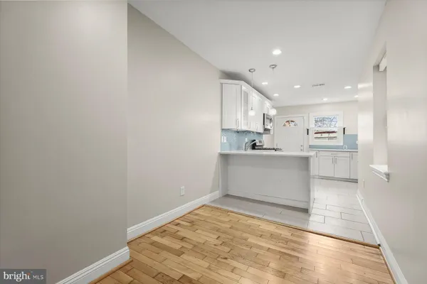 a view of kitchen with wooden floor