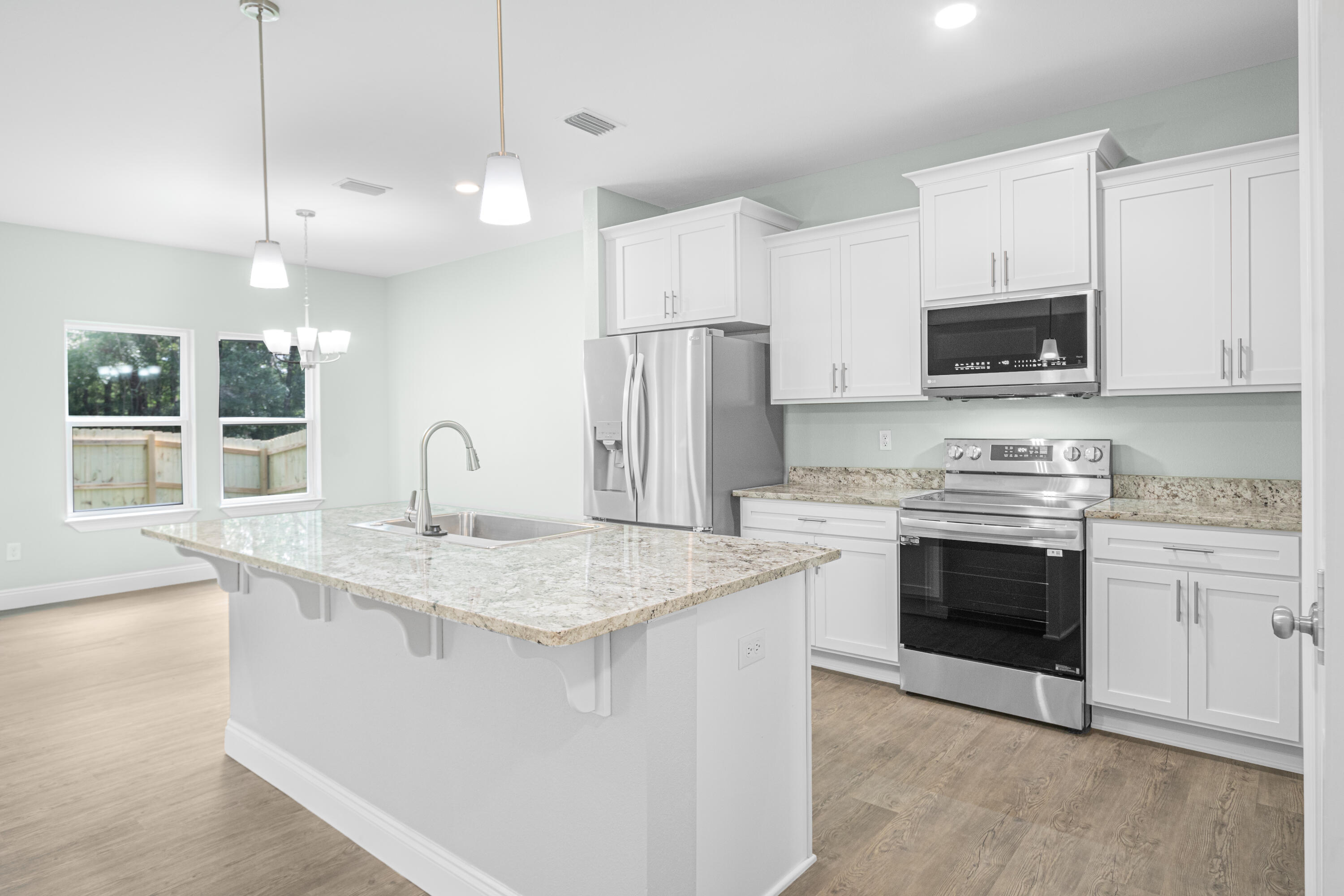 169 Johnson Court Crestview, FL 32536 - Photo 1 of 30 a kitchen with stainless steel appliances granite countertop a stove a sink and a refrigerator