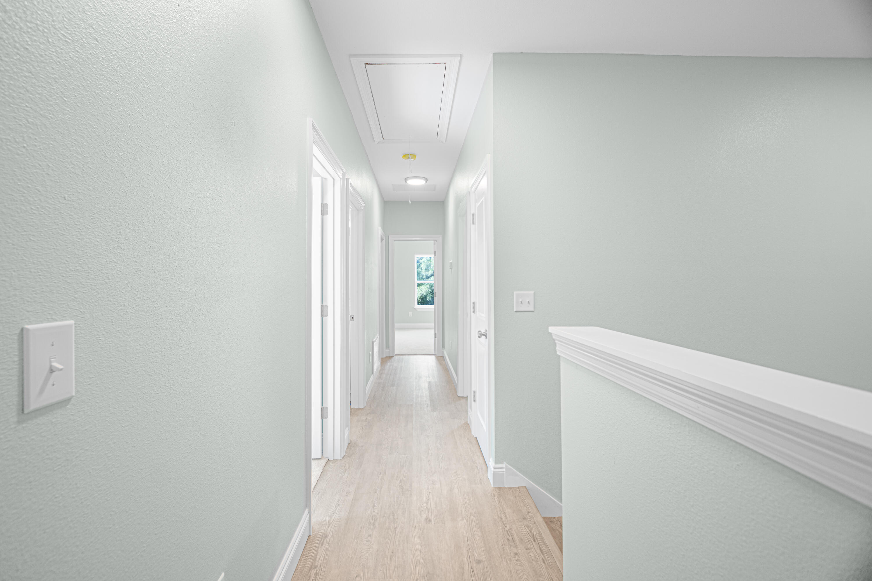 169 Johnson Court Crestview, FL 32536 - Photo 16 of 30 a view of a hallway with wooden floor