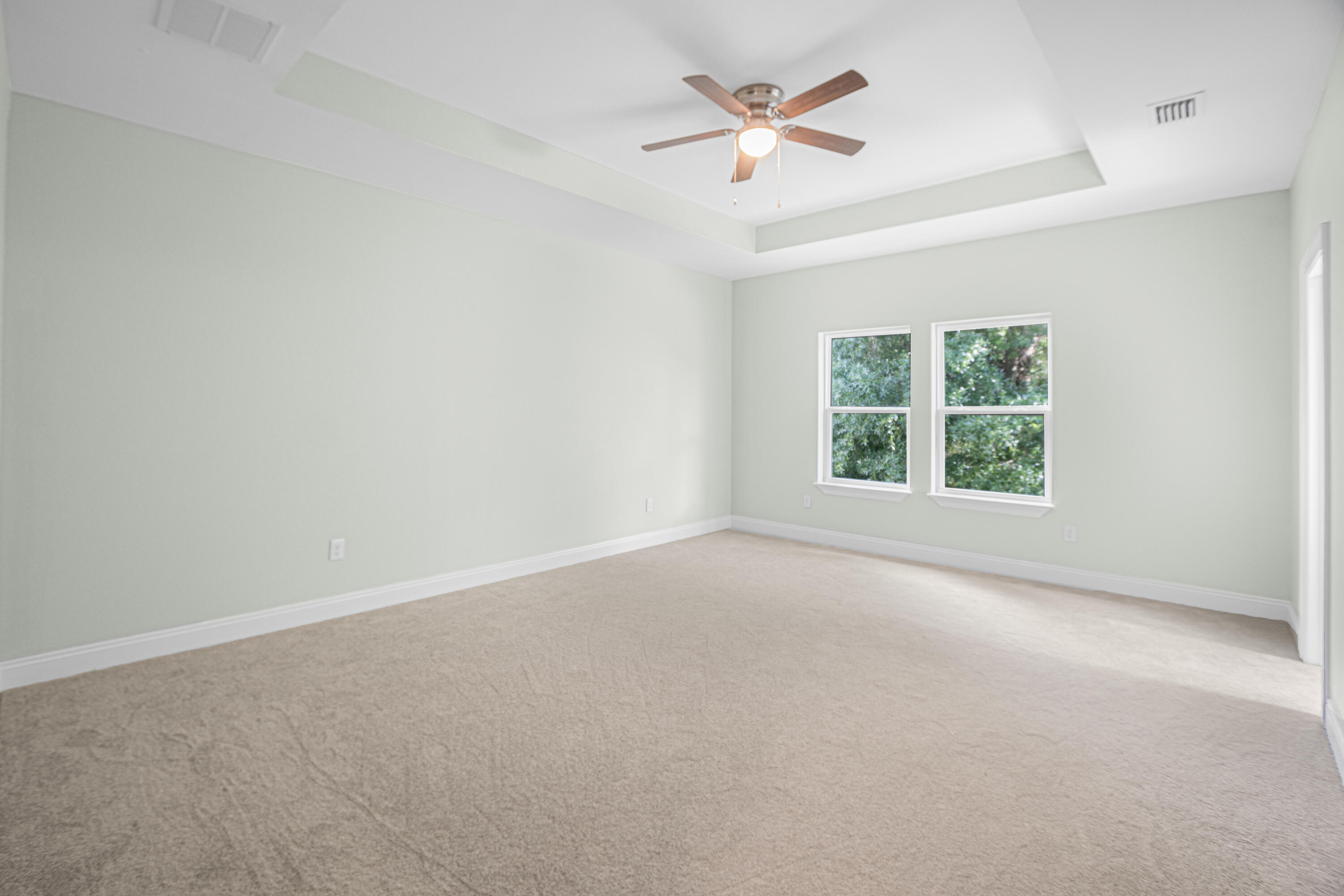169 Johnson Court Crestview, FL 32536 - Photo 17 of 30 an empty room with a window and a fan