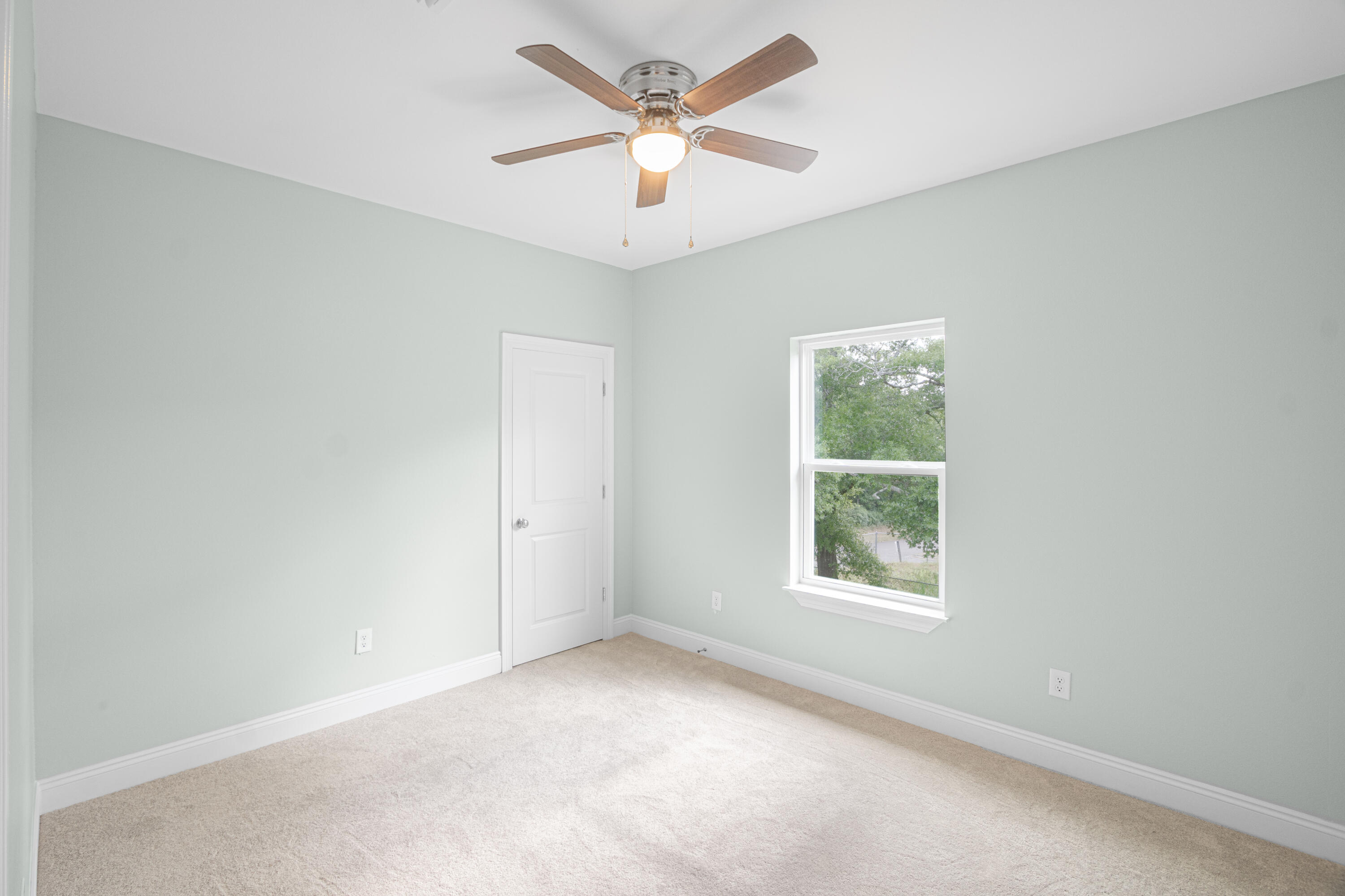 169 Johnson Court Crestview, FL 32536 - Photo 23 of 30 an empty room with a window and a fan