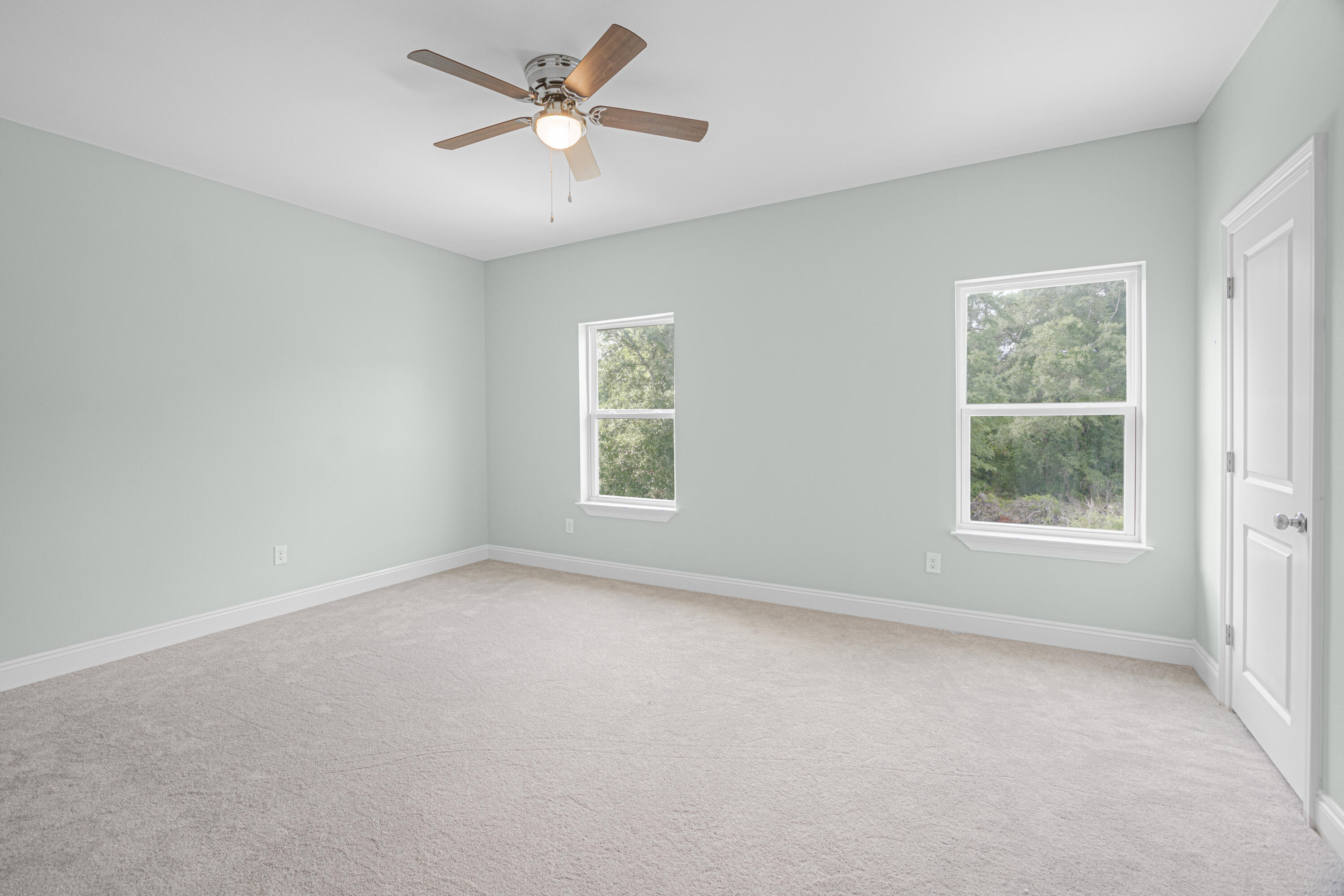169 Johnson Court Crestview, FL 32536 - Photo 29 of 30 an empty room with a window and a fan