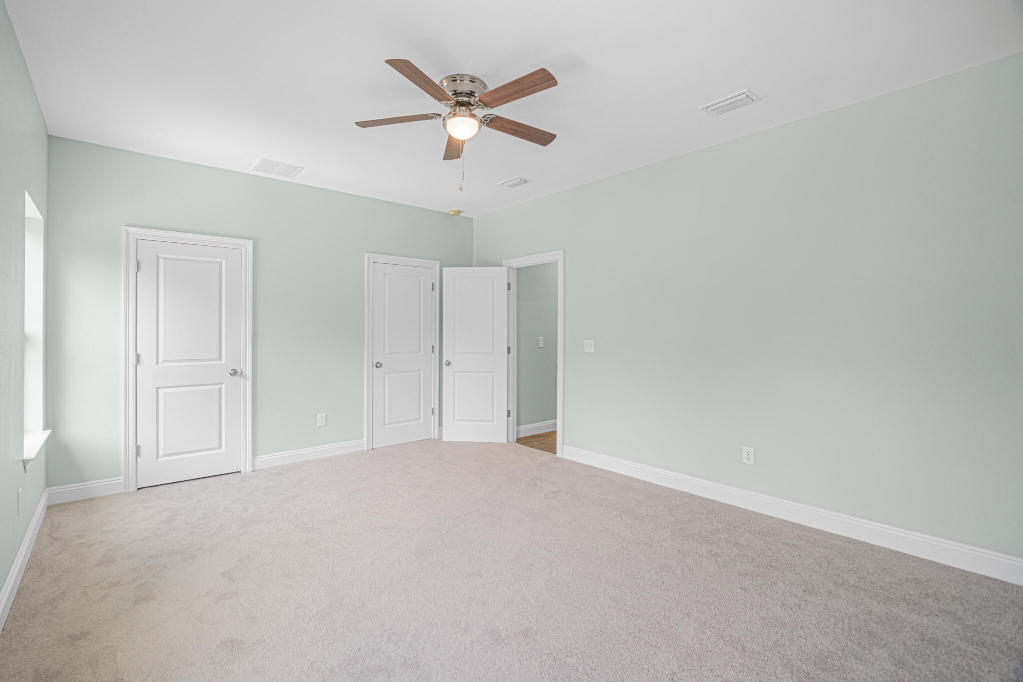 169 Johnson Court Crestview, FL 32536 - Photo 30 of 30 an empty room with ceiling fan and window