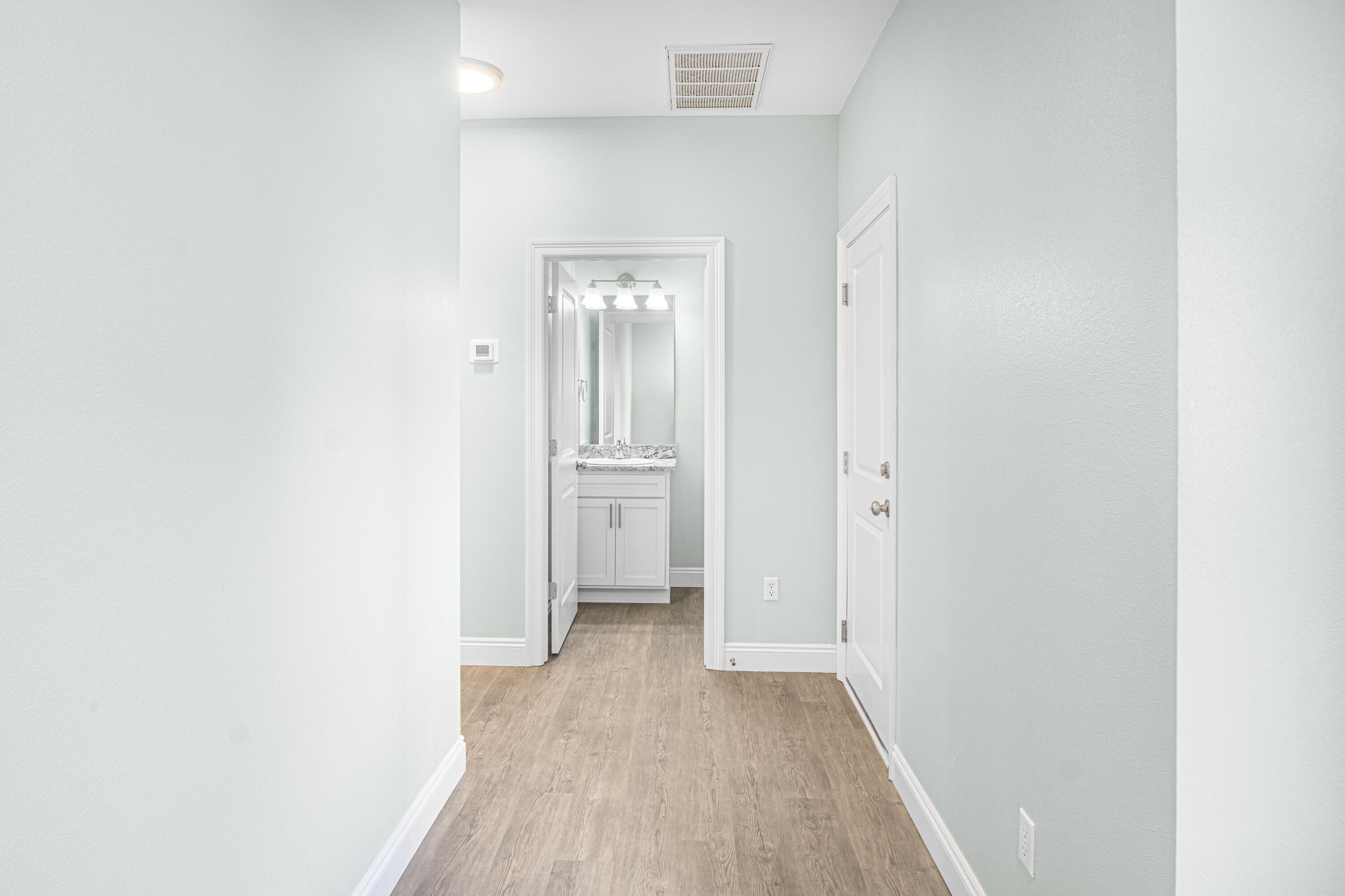 169 Johnson Court Crestview, FL 32536 - Photo 6 of 30 a view of a hallway with wooden floor