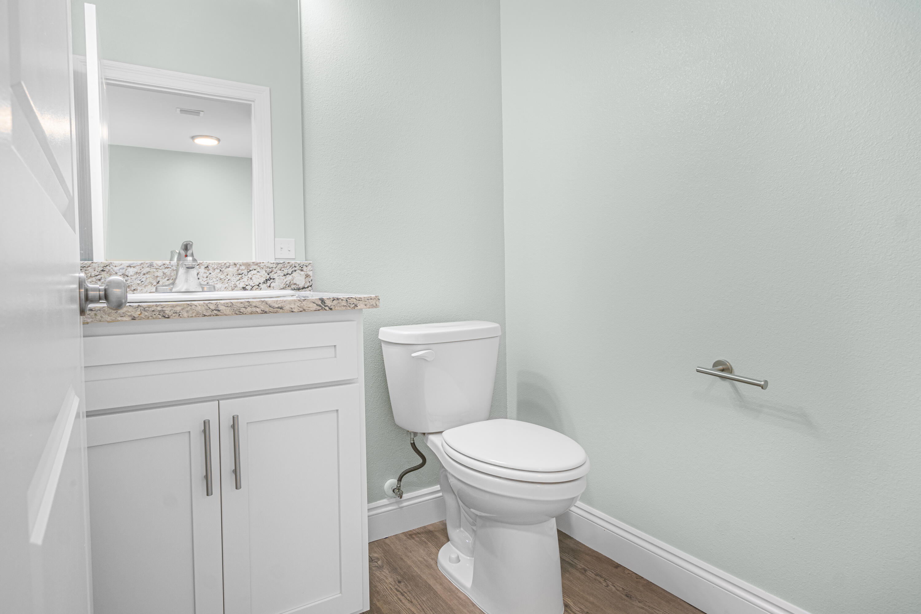 169 Johnson Court Crestview, FL 32536 - Photo 7 of 30 a bathroom with a granite countertop toilet and a sink