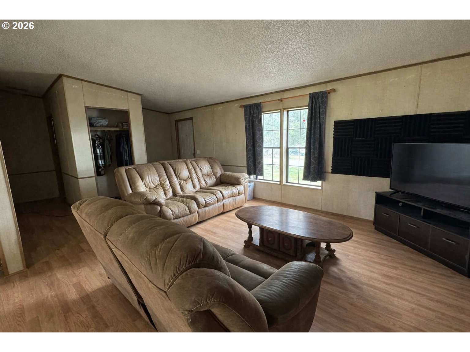 701 2nd Street Cove, OR 97824 - Photo 2 of 13 a living room with furniture flat screen tv and a fireplace