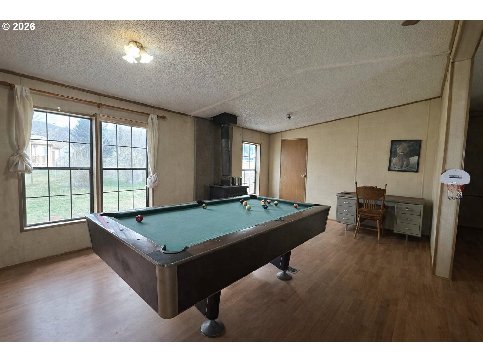 701 2nd Street Cove, OR 97824 - Photo 3 of 13 a room with pool table and windows