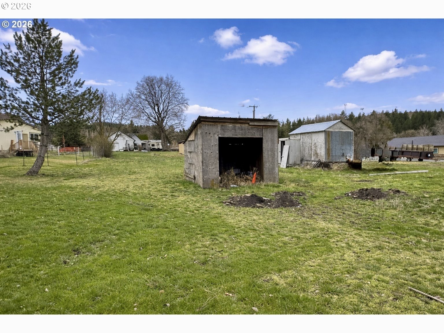 701 2nd Street Cove, OR 97824 - Photo 10 of 13 a view of a house with a yard