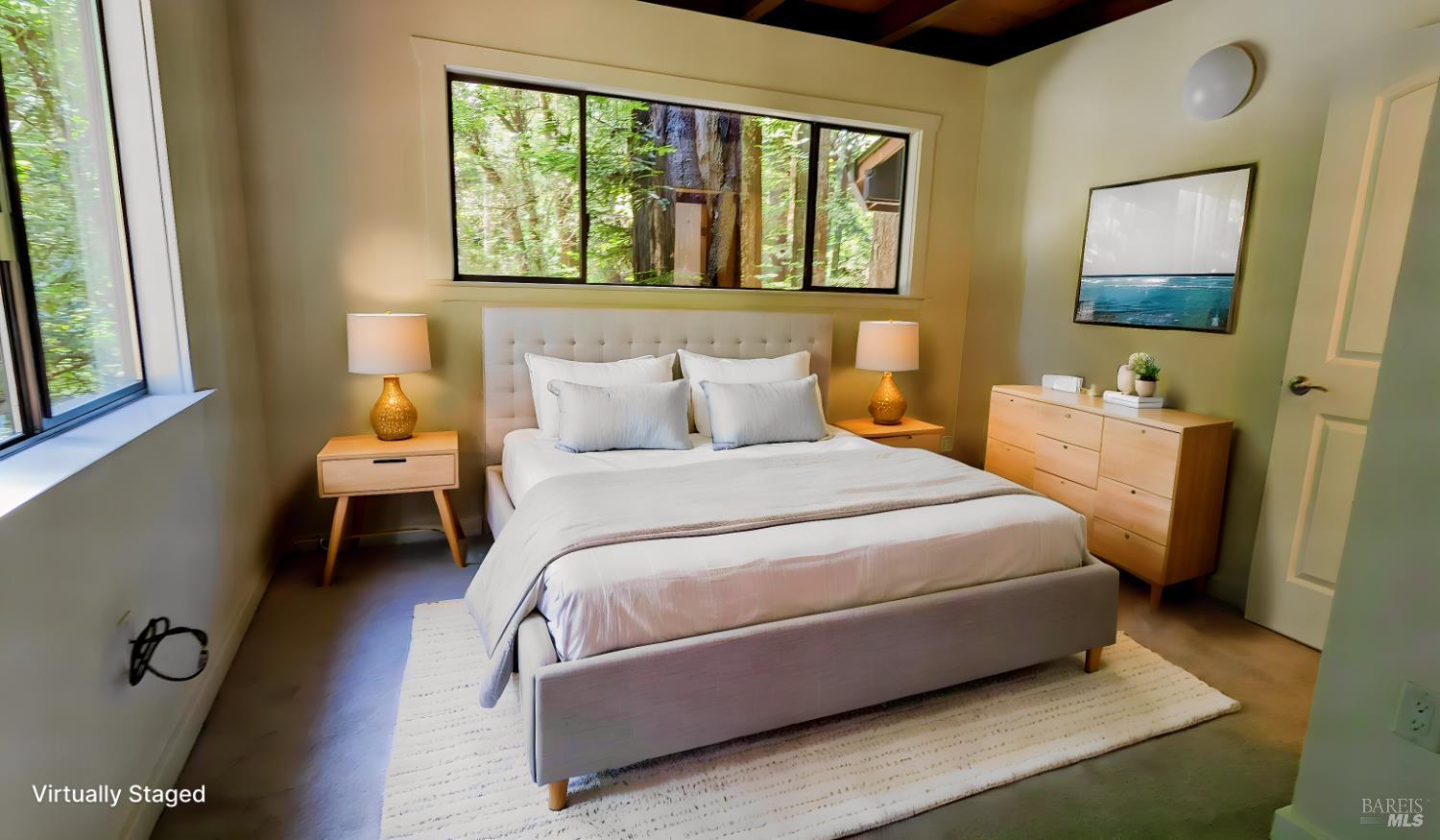 14911 Canyon 7 Road Guerneville, CA 95446 - Photo 15 of 32 a bedroom with a bed and a window