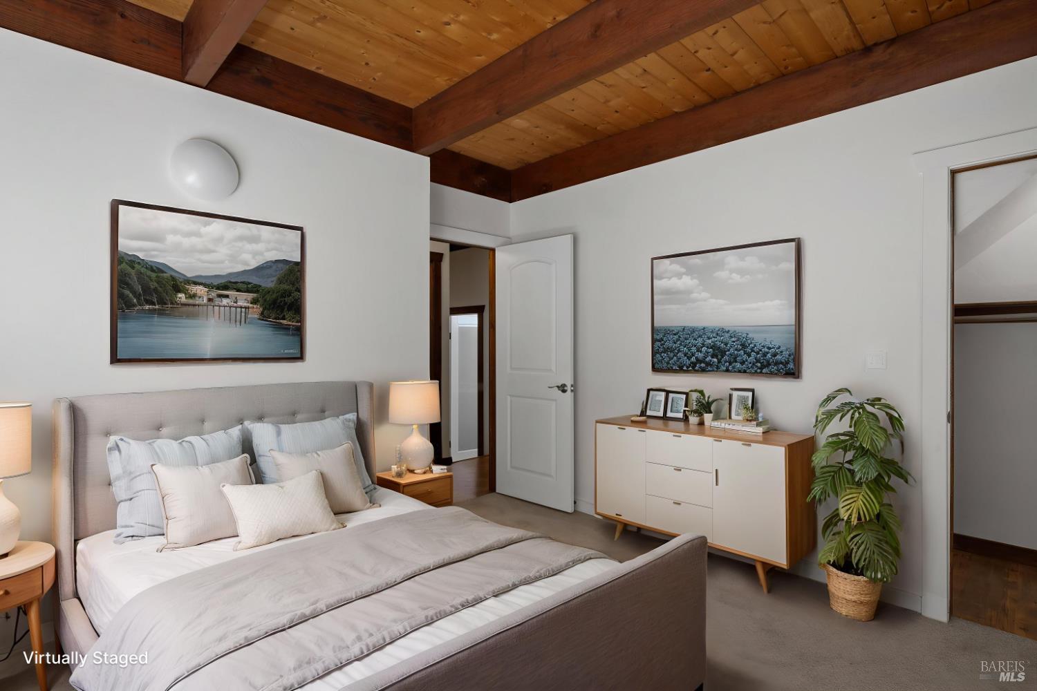 14911 Canyon 7 Road Guerneville, CA 95446 - Photo 17 of 32 a bedroom with a bed and a flat screen tv