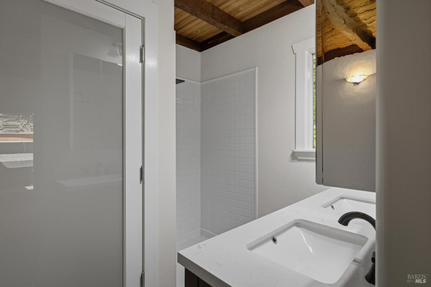 14911 Canyon 7 Road Guerneville, CA 95446 - Photo 22 of 32 a bathroom with a sink a toilet and shower