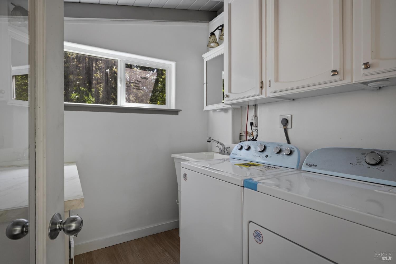 14911 Canyon 7 Road Guerneville, CA 95446 - Photo 24 of 32 a bathroom with a sink and cabinets