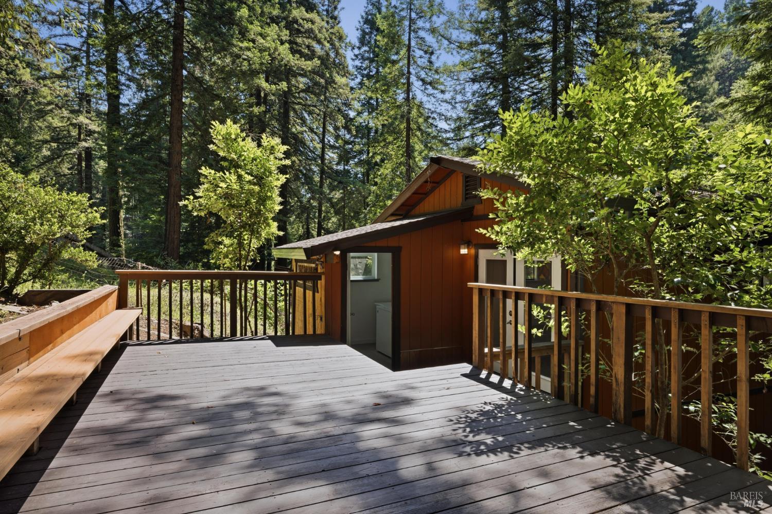 14911 Canyon 7 Road Guerneville, CA 95446 - Photo 25 of 32 a balcony with wooden floor and fence