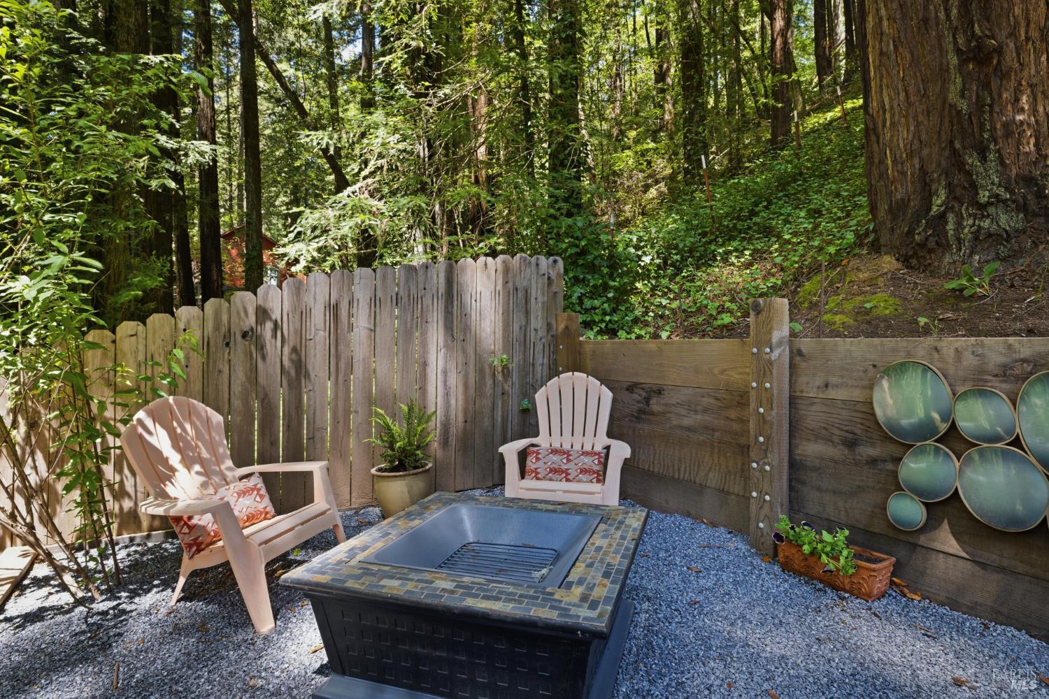 14911 Canyon 7 Road Guerneville, CA 95446 - Photo 27 of 32 a view of a backyard with furniture